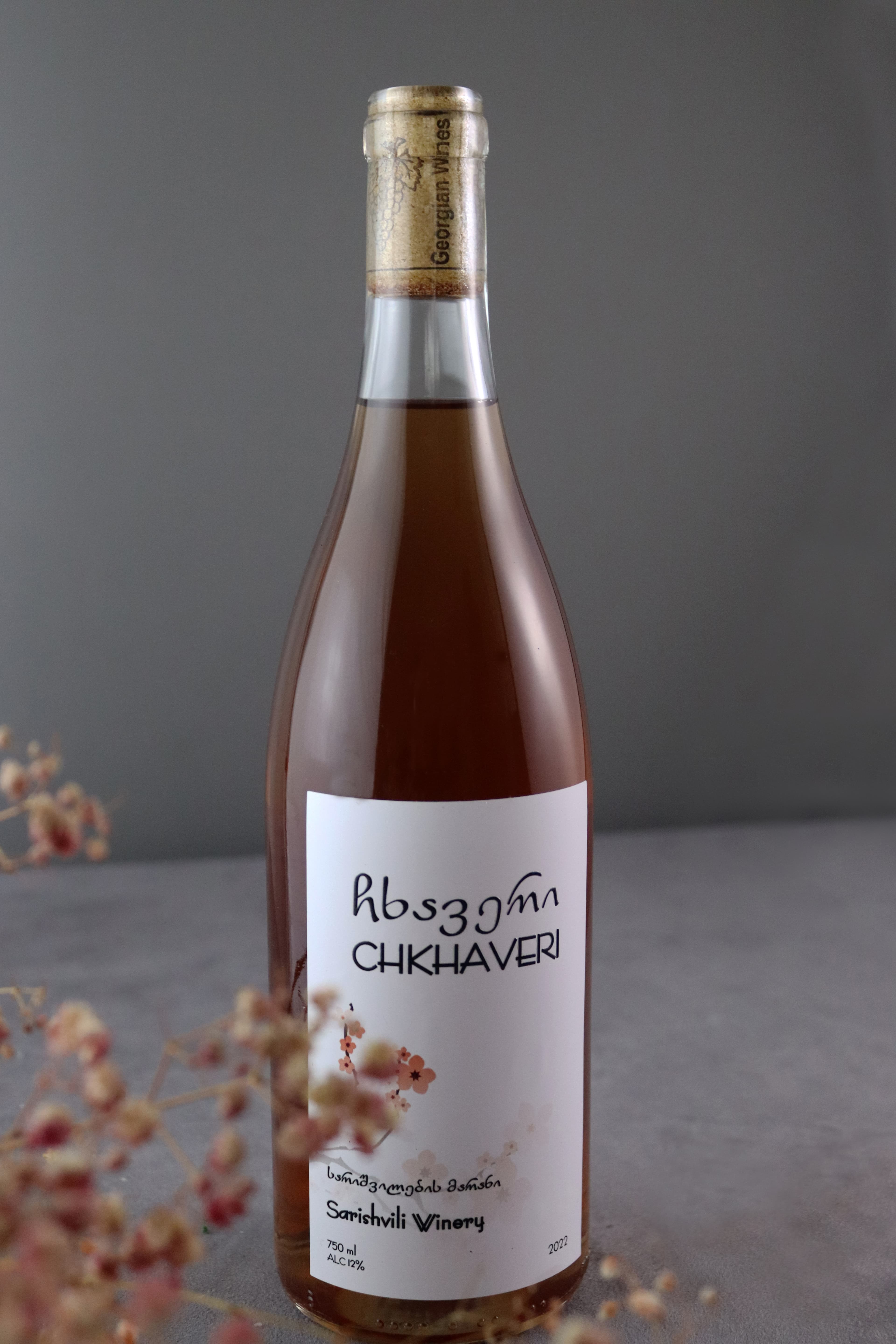 Sarishvili Ckhaveri Rosé 2024 bottle with bokeh flowers